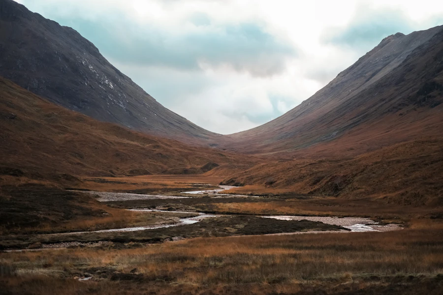 A green Highland glen with mountains on either side