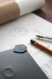 a cell phone sitting on top of a piece of paper