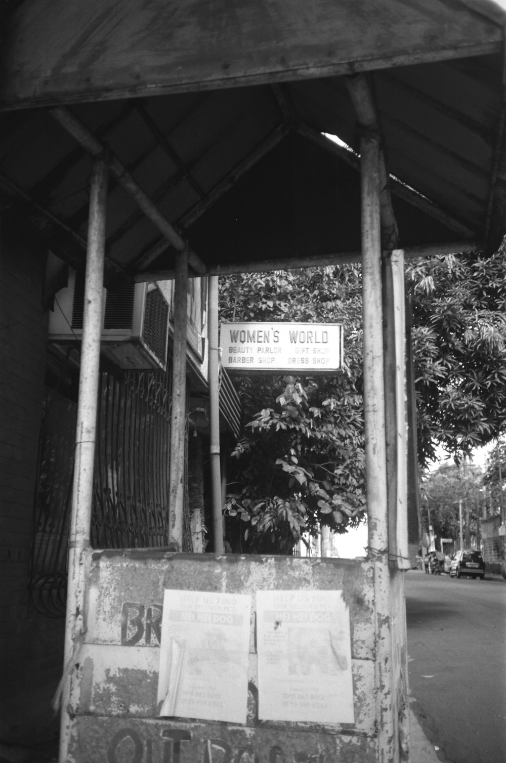 a black and white photo of a women's world sign