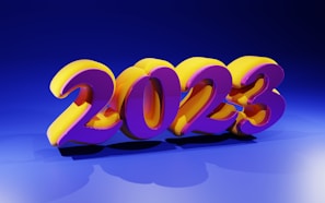Bright and colorful 3D numbers displaying '2023' are prominently positioned in the center. The numbers are stylized with a vibrant purple and yellow color scheme, casting shadows on a blue background. The lighting creates a glossy and reflective effect on the numbers.