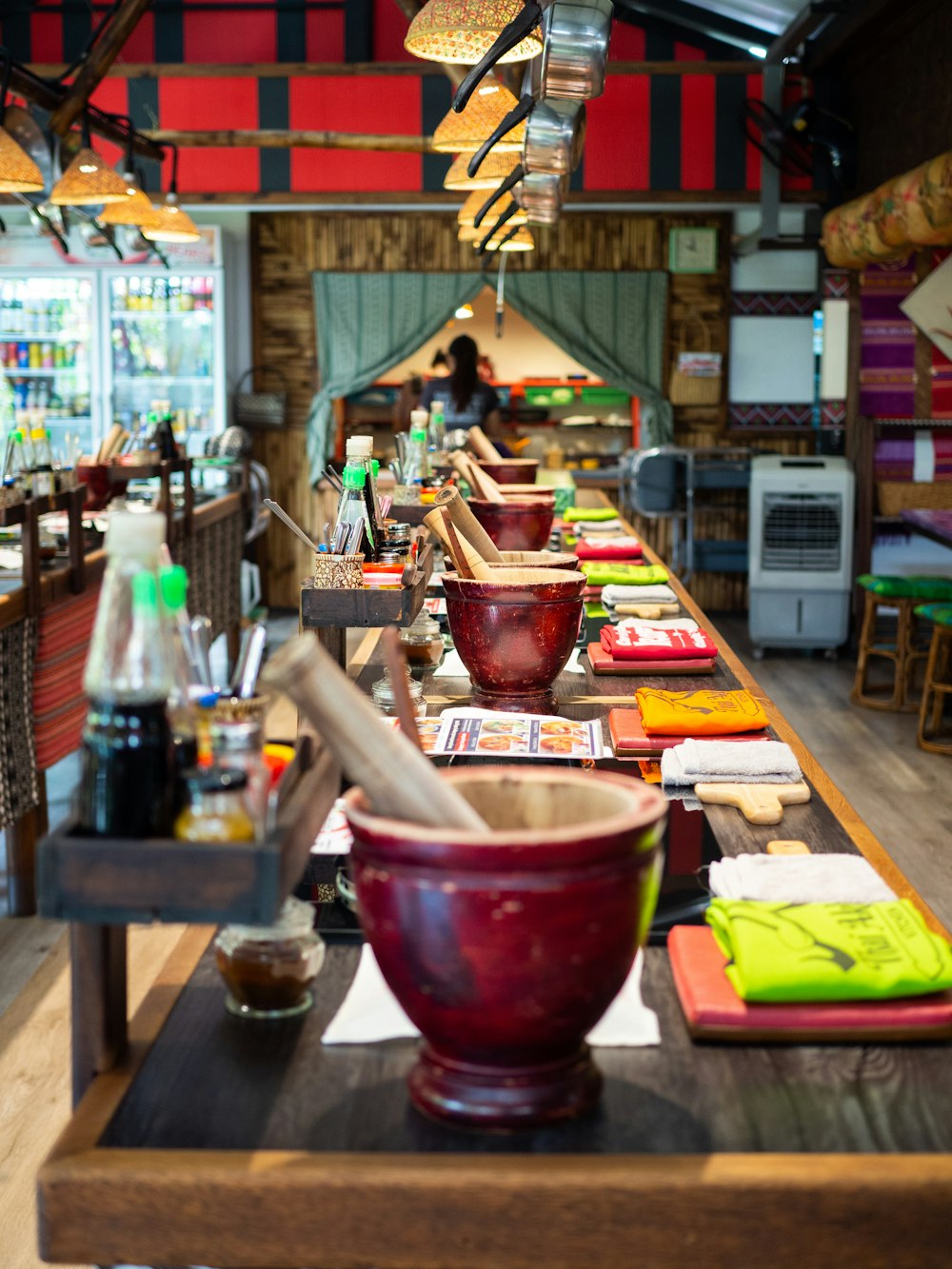 a long table with a bowl of food on top of it