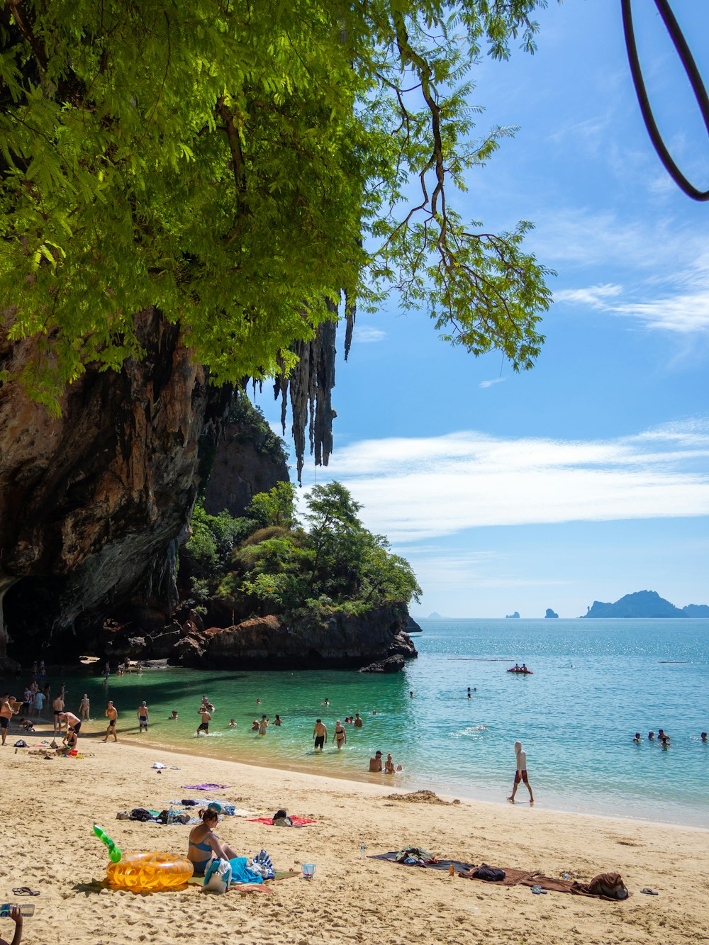 a beach filled with lots of people on top of it