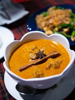 a bowl of soup with a spoon in it