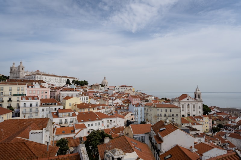 Alfama neighborhood rooftops and São Jorge Castle hill seen from above, Lisbon