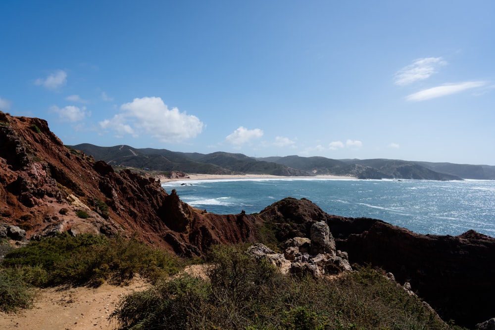 a view of the ocean from a rocky outcropping