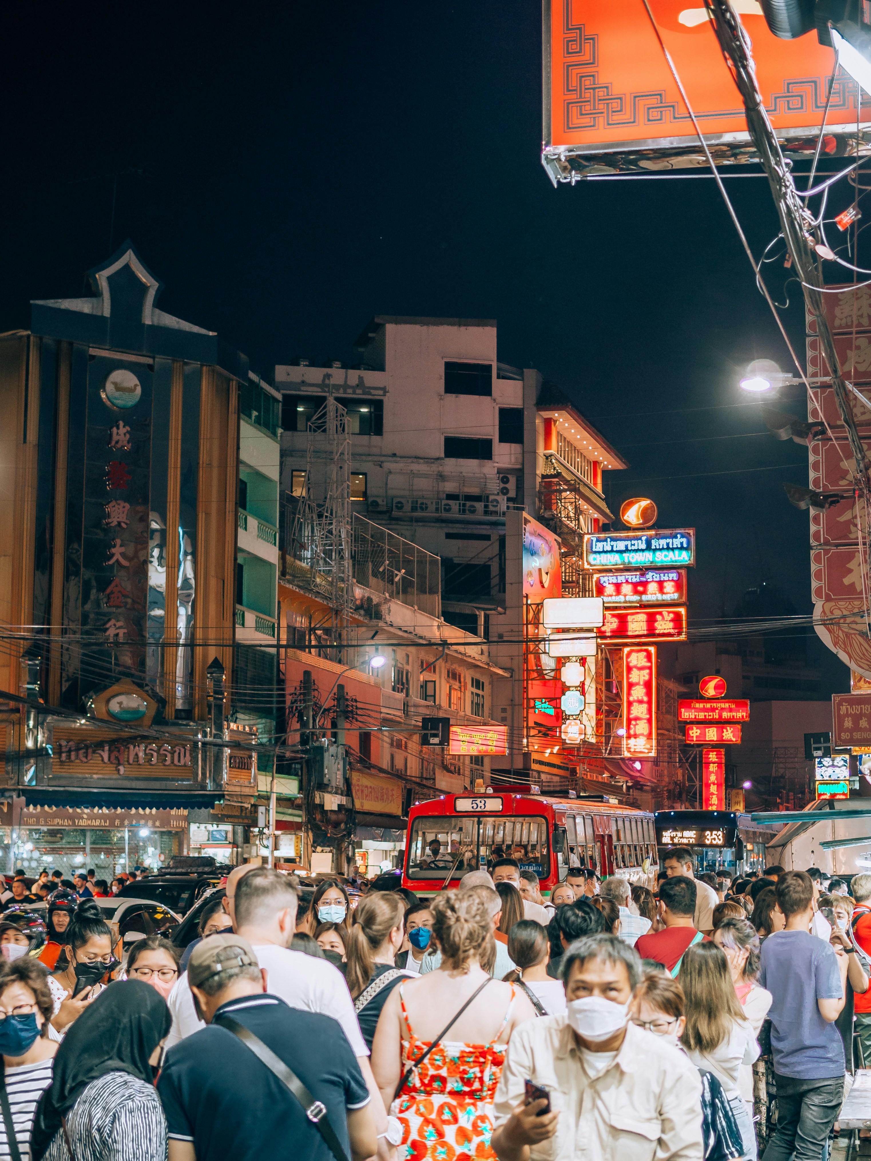 The Best Times to Visit Popular Destinations—Before Prices or Crowds Peak – a crowd of people walking down a street at night