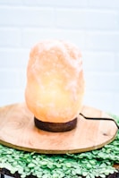 a himalayan lamp sitting on top of a wooden stand
