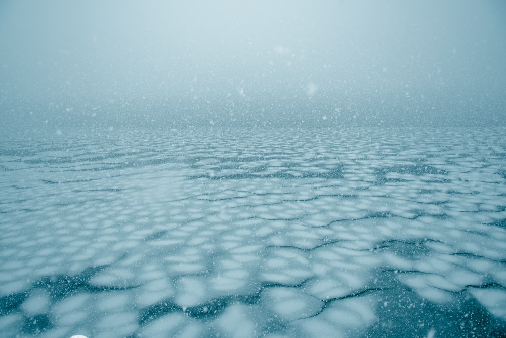a view of a body of water covered in snow
