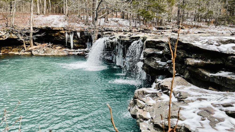 a small waterfall in the middle of a river