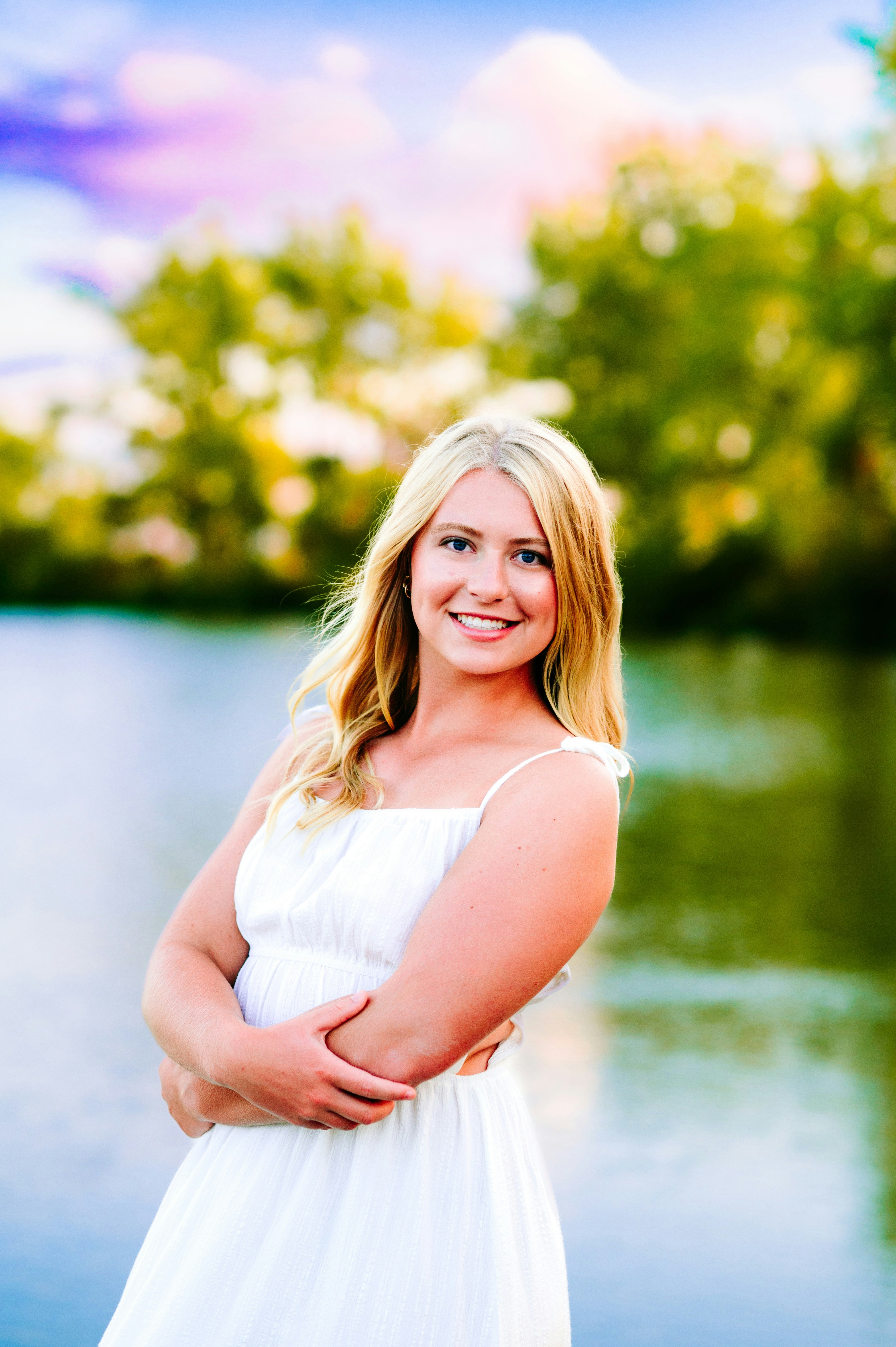 A woman in a white dress posing for a picture photo – Free Beach Image ...