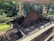 Photo of a rugged sawmill in action with the Vertamedis controller mounted on the electric motor setup.
