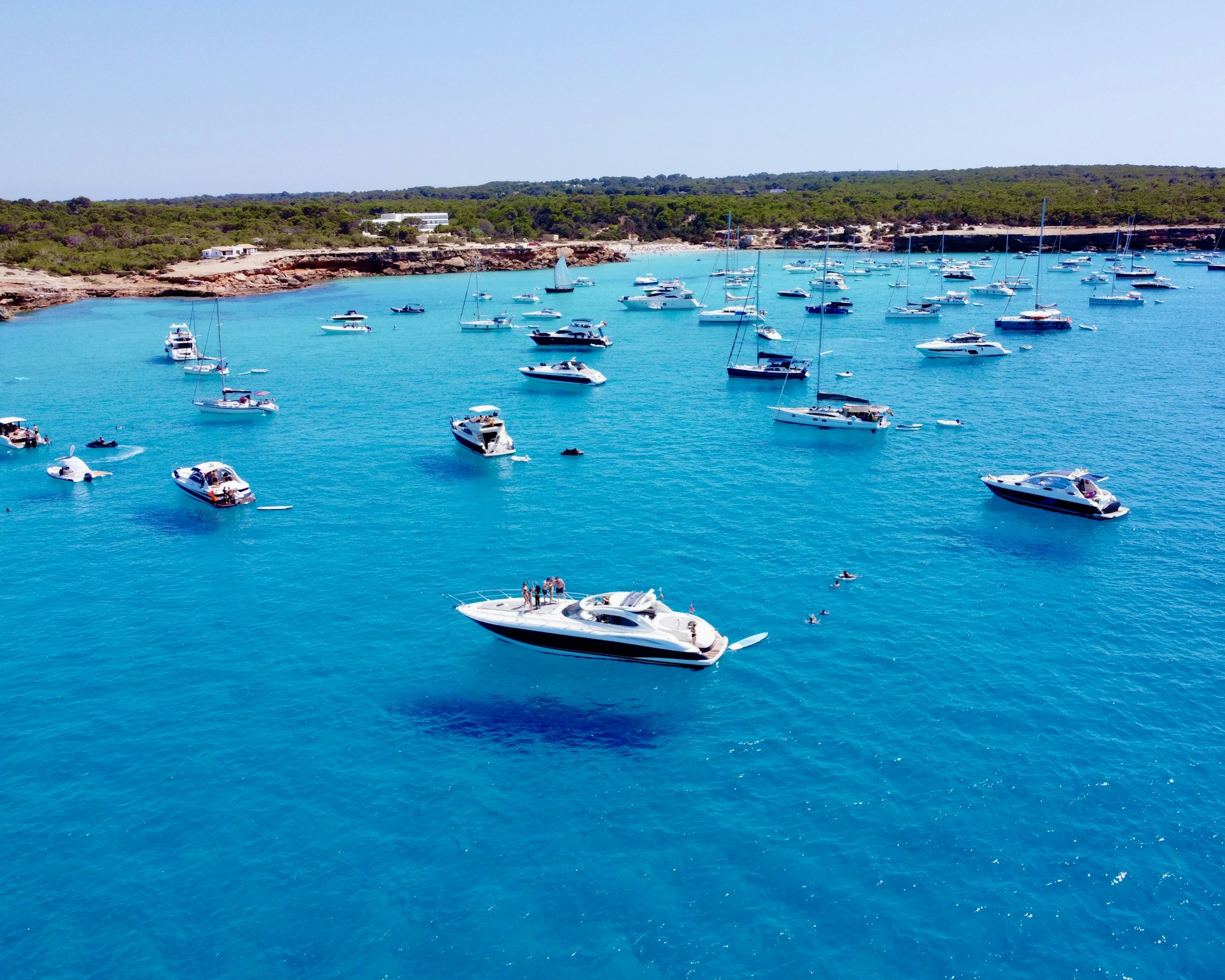 a group of boats floating on top of a body of water