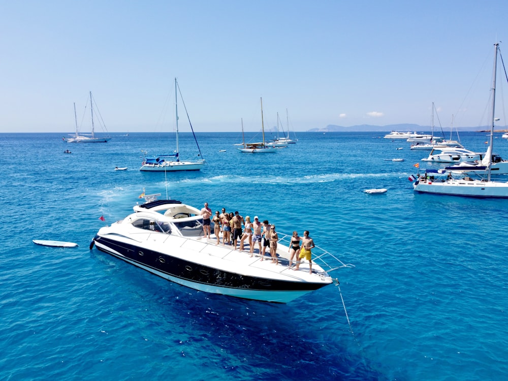 a group of people on a boat in the ocean