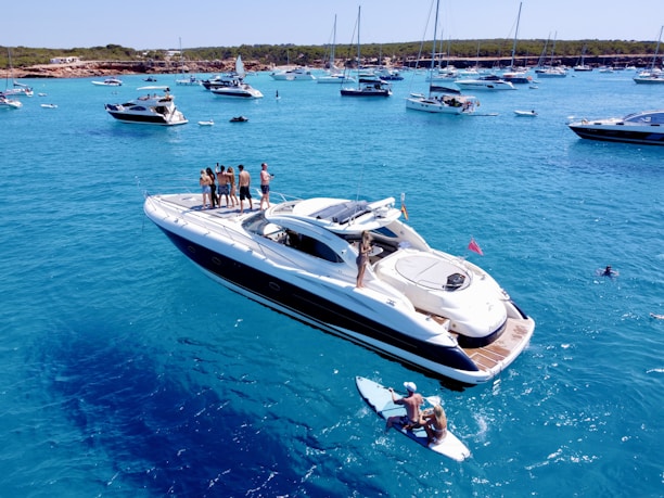 a group of people standing on a boat in the water