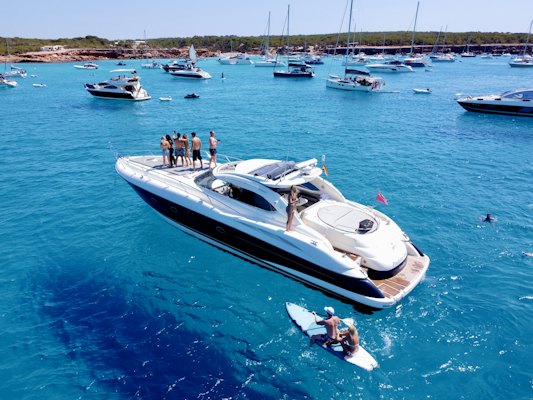 A group of people standing on a boat in the water — Ibiza, Spain