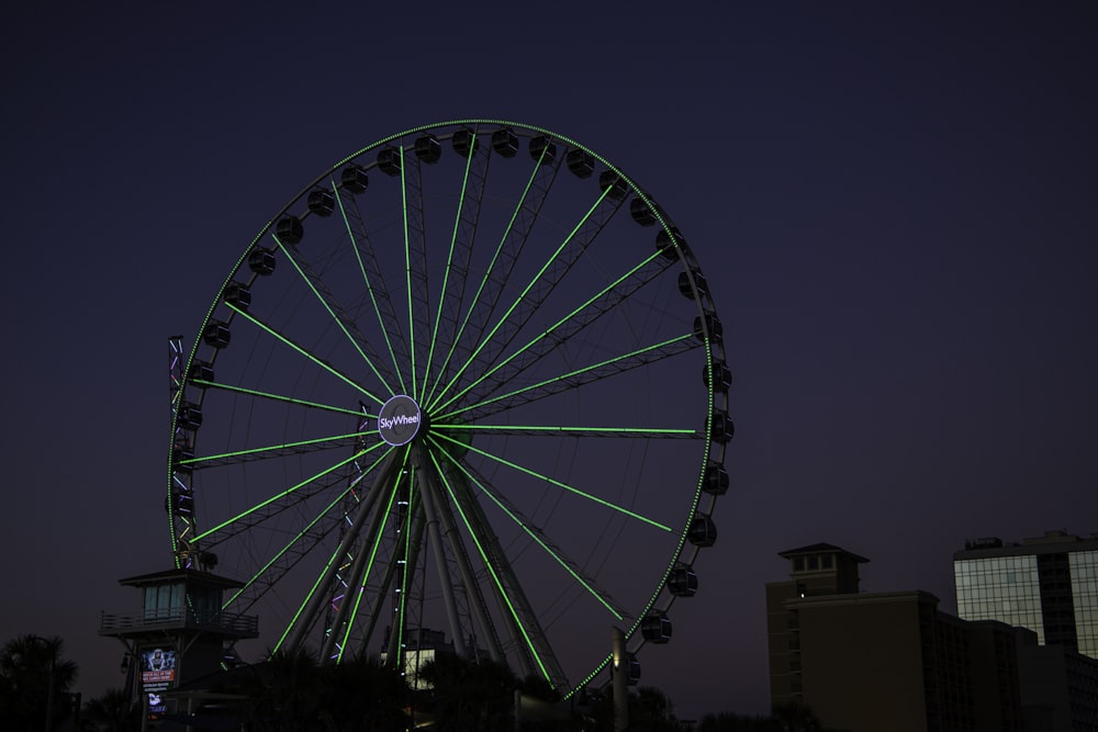 a large ferris wheel lit up at night