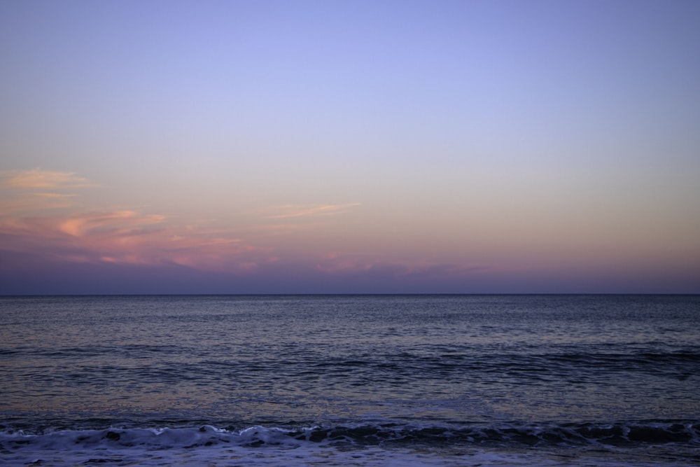 a view of a body of water at sunset