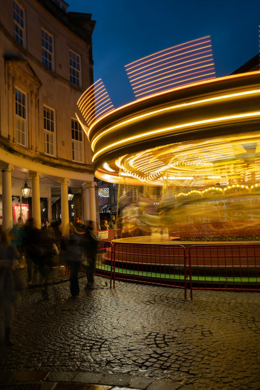 a blurry photo of a carousel at night