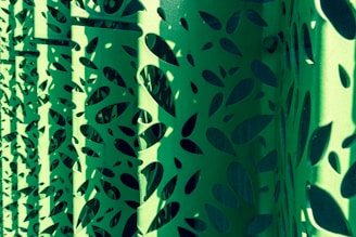 Finished metal panels showcasing detailed geometric designs created by laser cutting