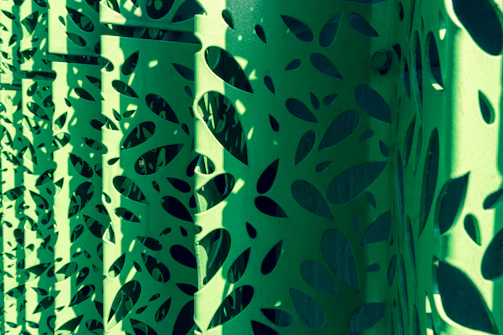 Steel decor panels with intricate laser-cut patterns ready for installation