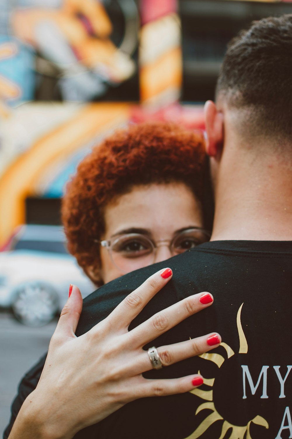 a man and a woman embracing each other