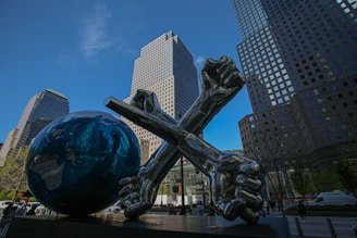 a statue of a person holding a cross