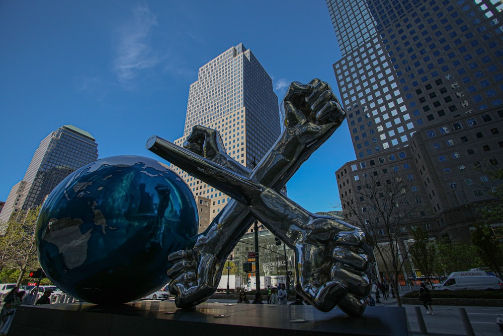 a statue of a person holding a cross