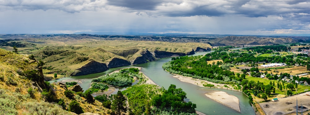 a river running through a lush green valley