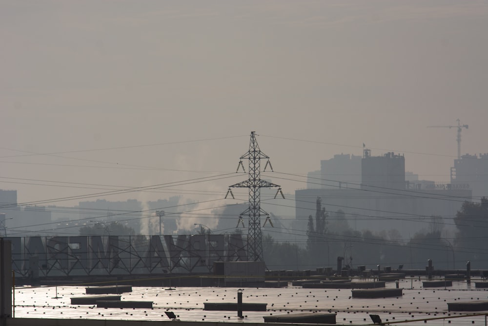a view of a power line with a city in the background