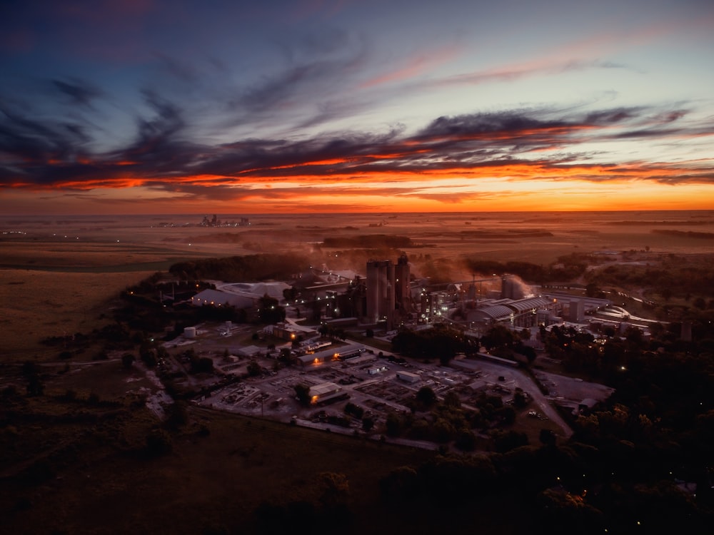 an aerial view of a city at sunset