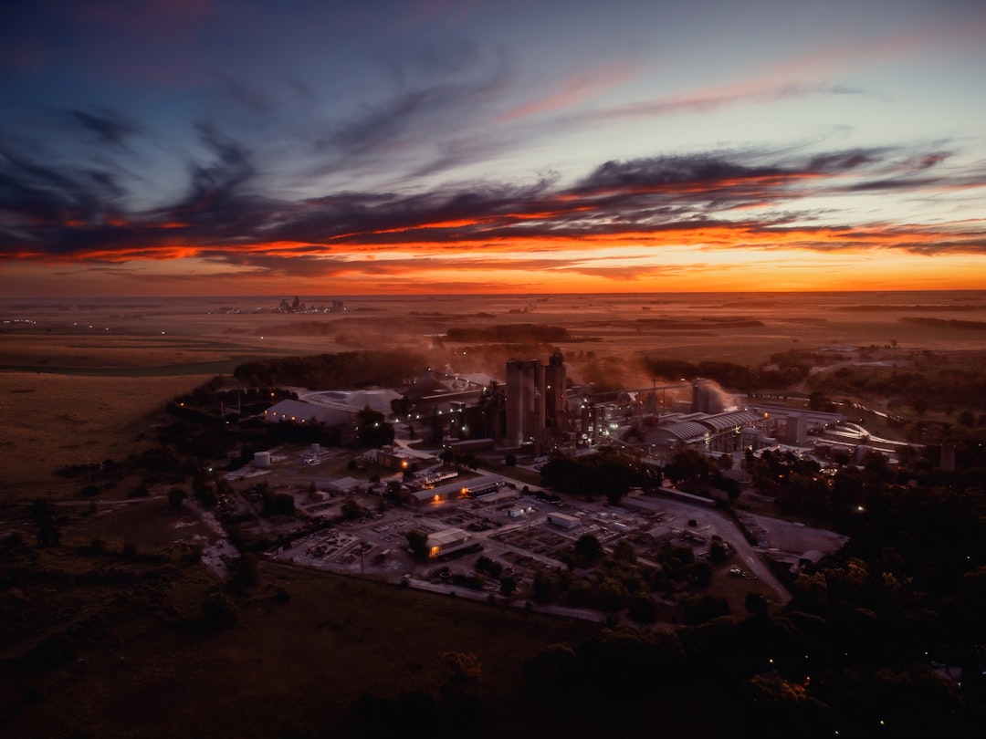 an aerial view of a city at sunset,
