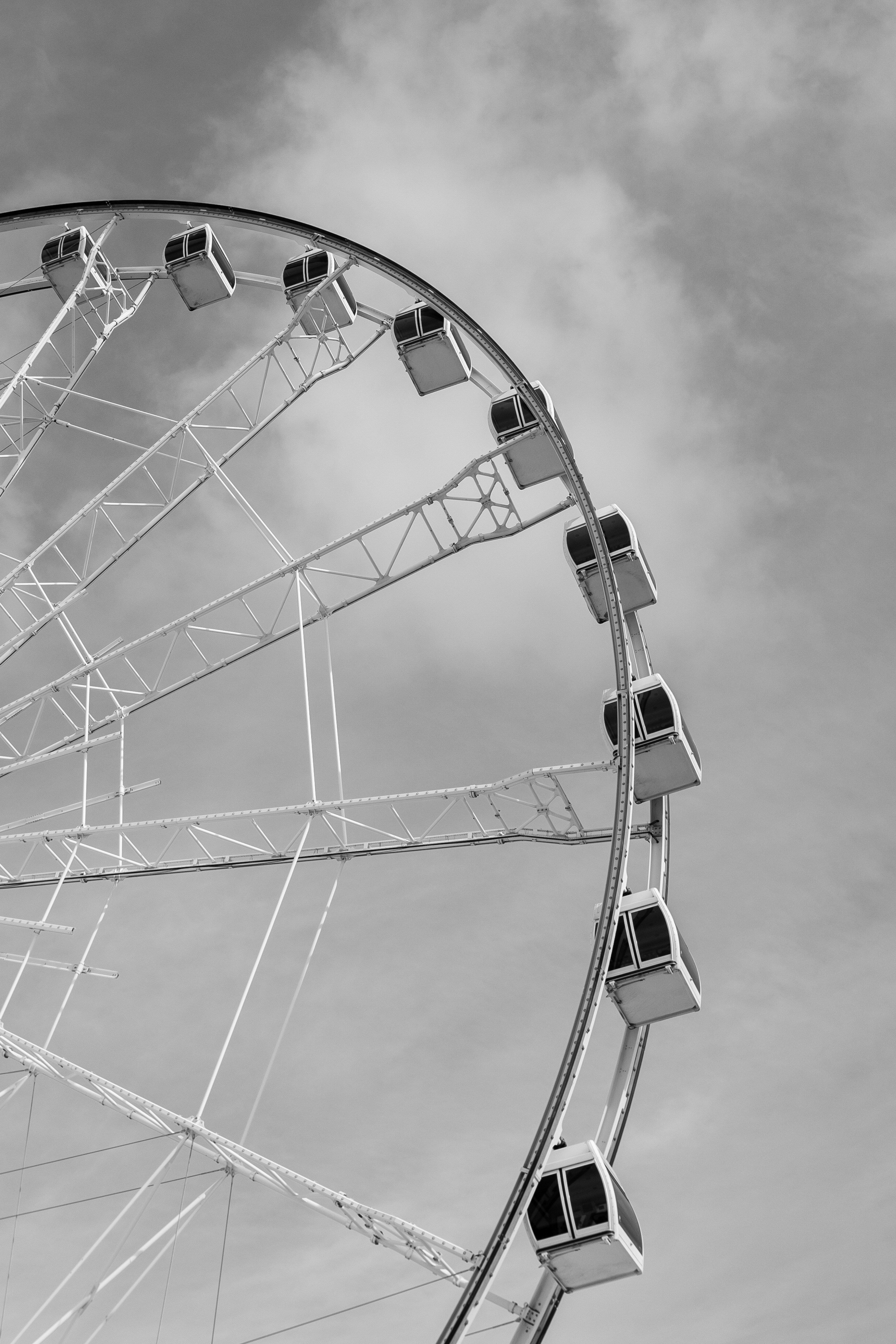 a black and white photo of a ferris wheel