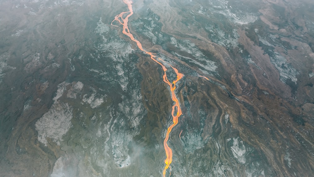 an aerial view of a river in the mountains