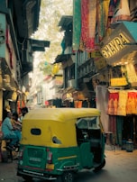 A bustling local market street in Sircilla with colorful shops and smiling people.