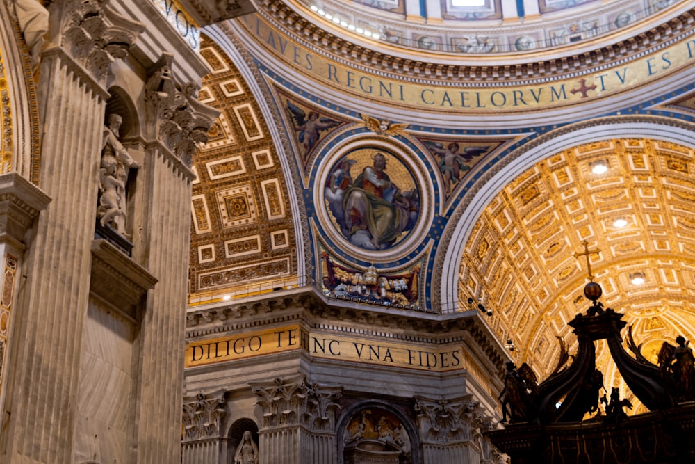 the interior of a church with a dome and paintings on the walls