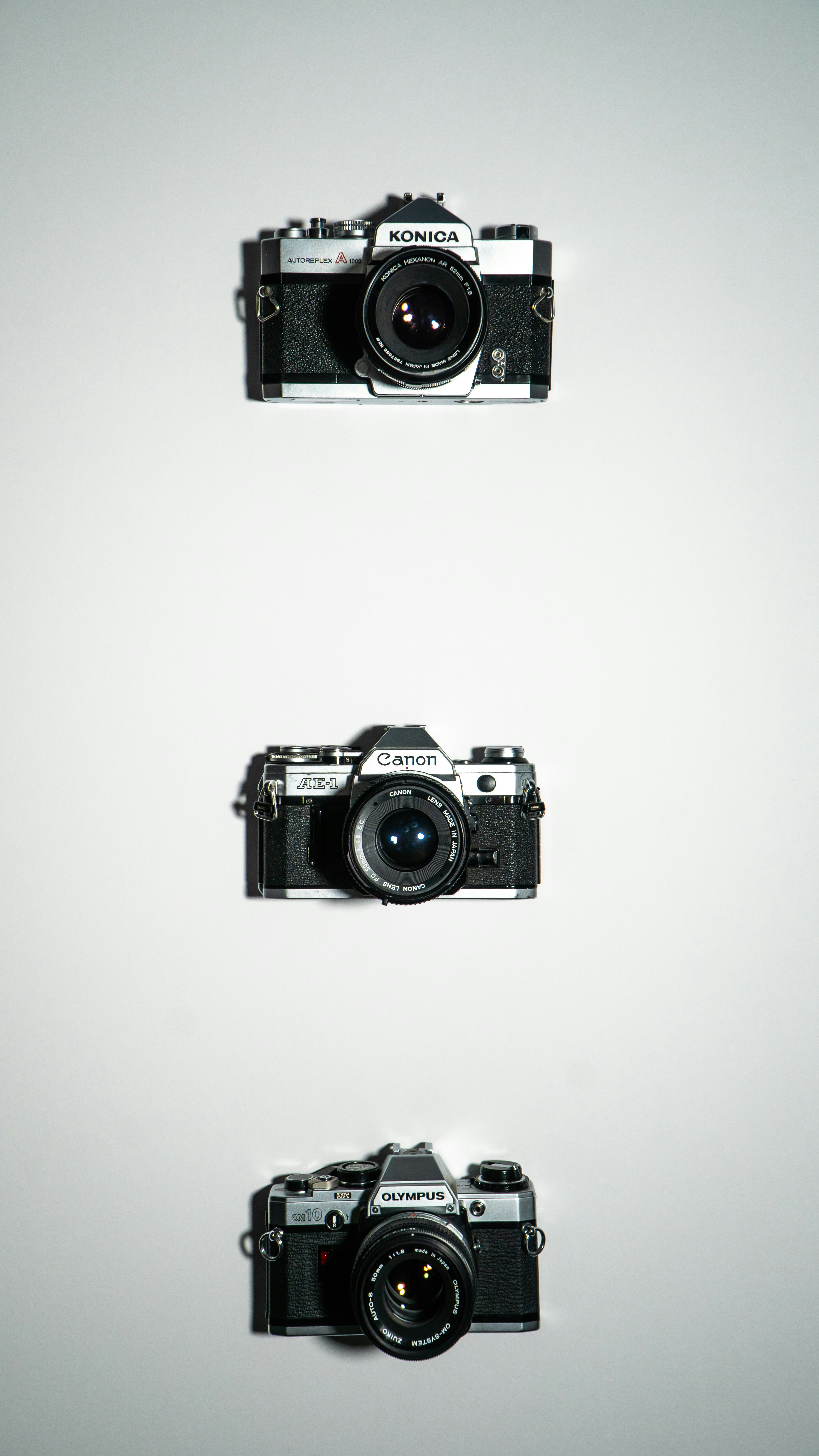 a couple of cameras sitting next to each other