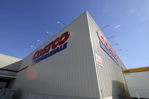a large white building with a red and blue sign on it