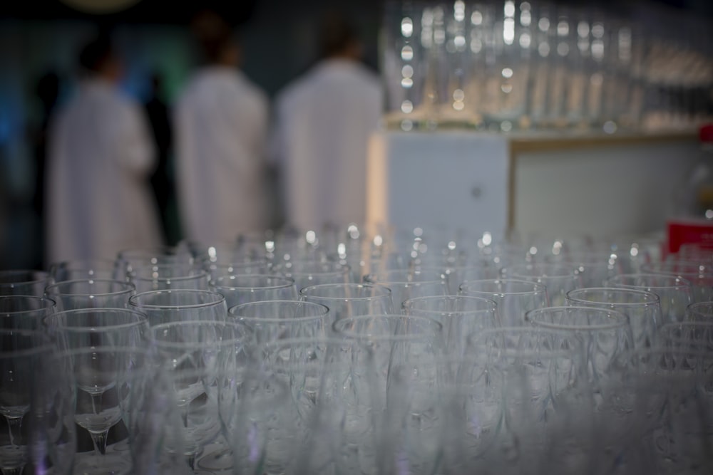 a bunch of wine glasses sitting on top of a table