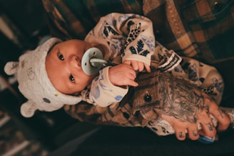 a baby with a pacifier in his mouth