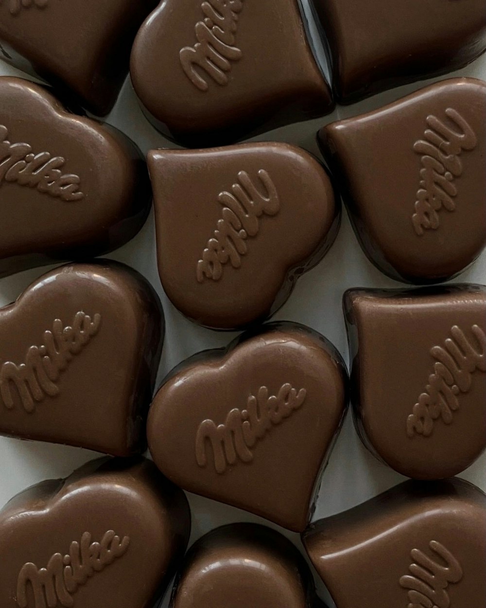 a box of chocolate hearts with names on them