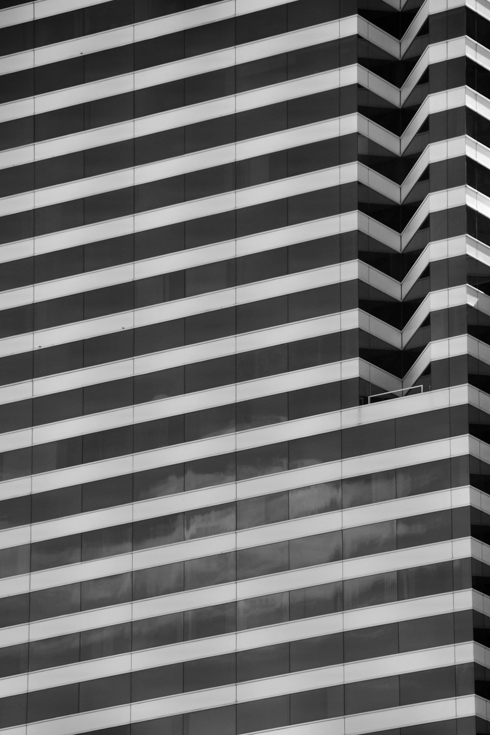 a black and white photo of a tall building