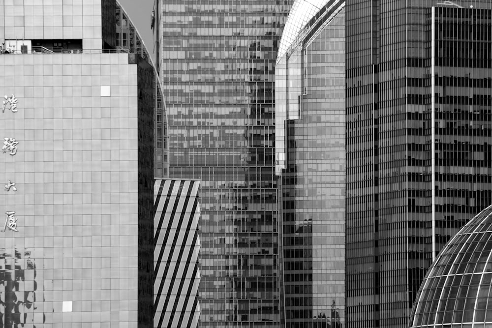 a black and white photo of skyscrapers in a city