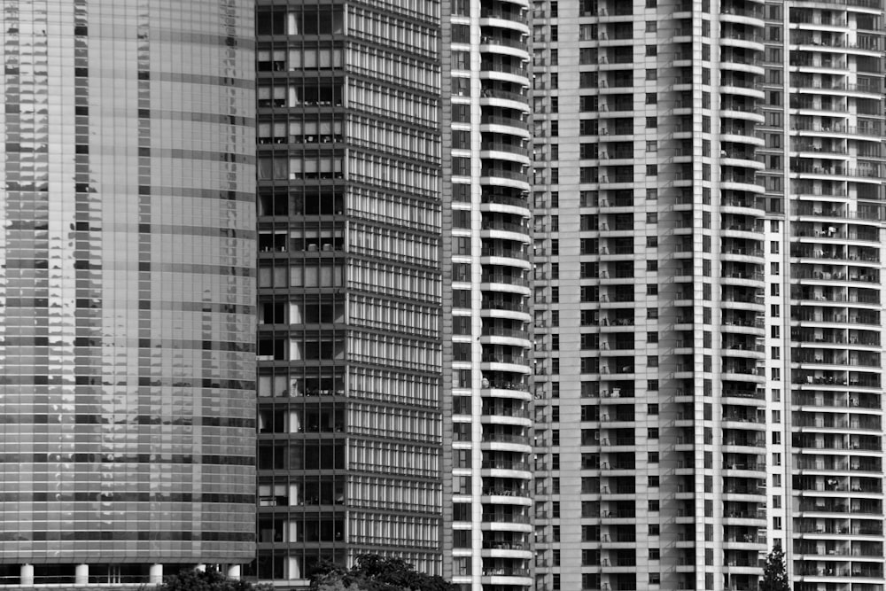 a black and white photo of tall buildings