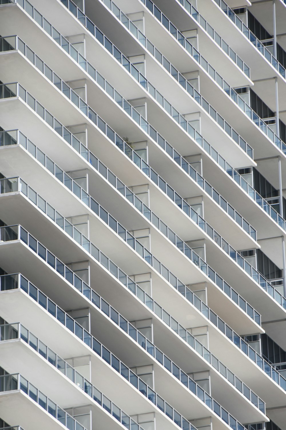 a large white building with balconies and balconies