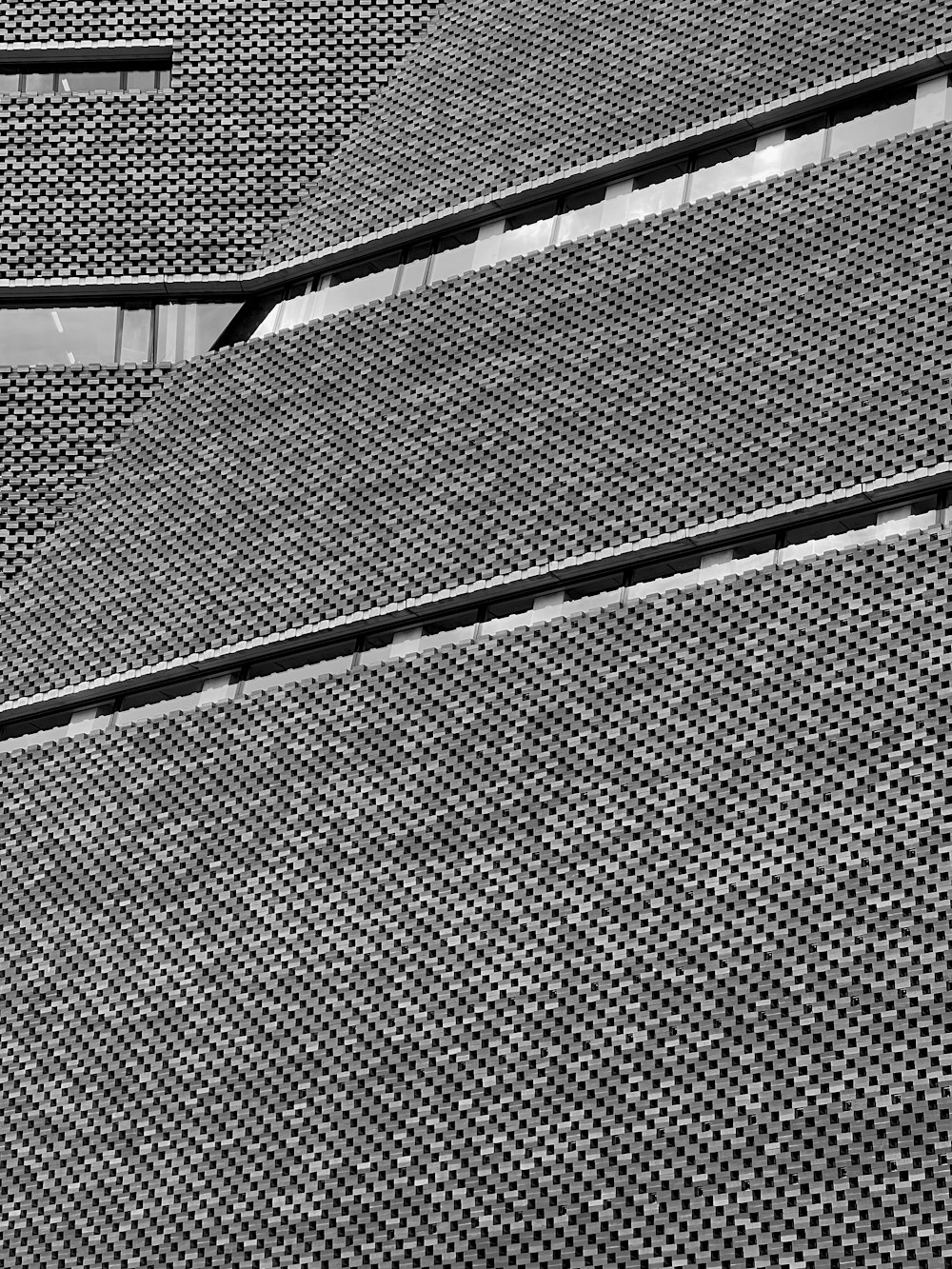 a black and white photo of a metal structure