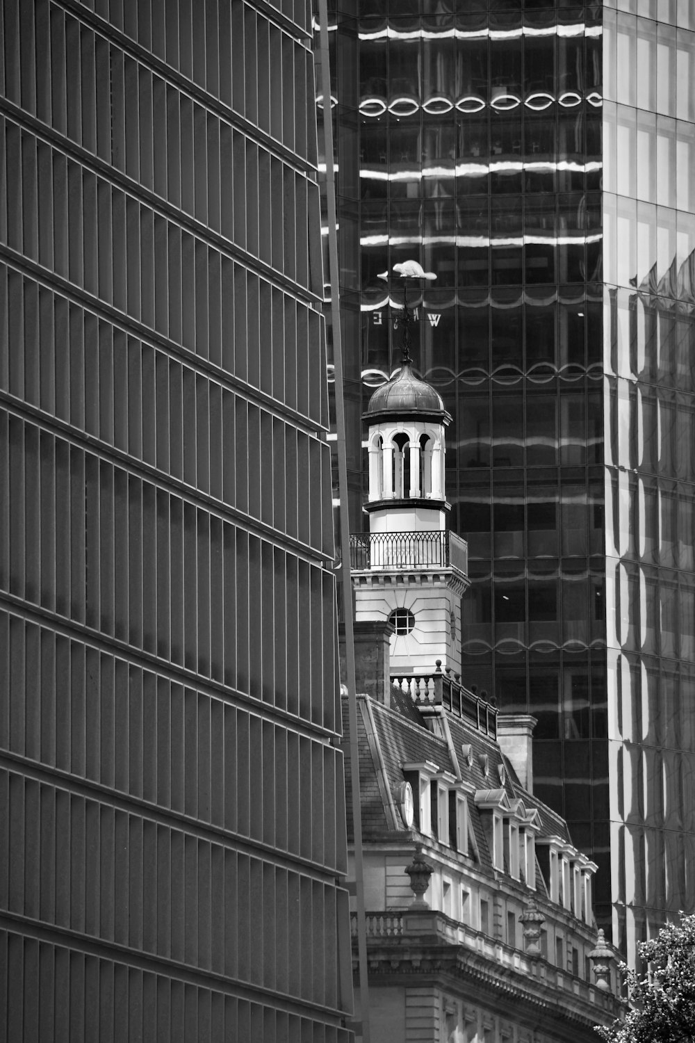 a black and white photo of a clock tower