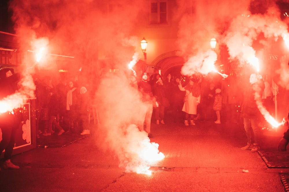 a group of people standing next to each other on a street