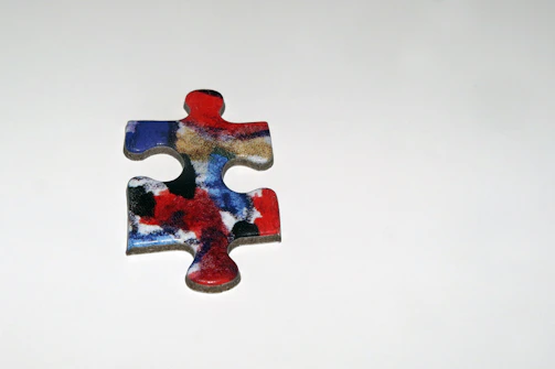 Close-up of a single puzzle mug with a small label reading 'piece 1 of 3' in the corner.