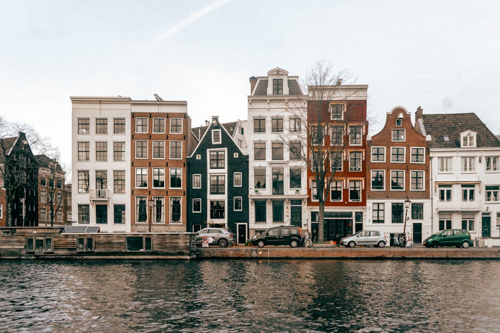 a body of water with a bunch of buildings in the background