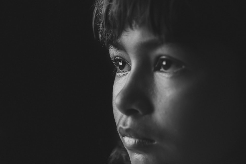 a black and white photo of a woman's face